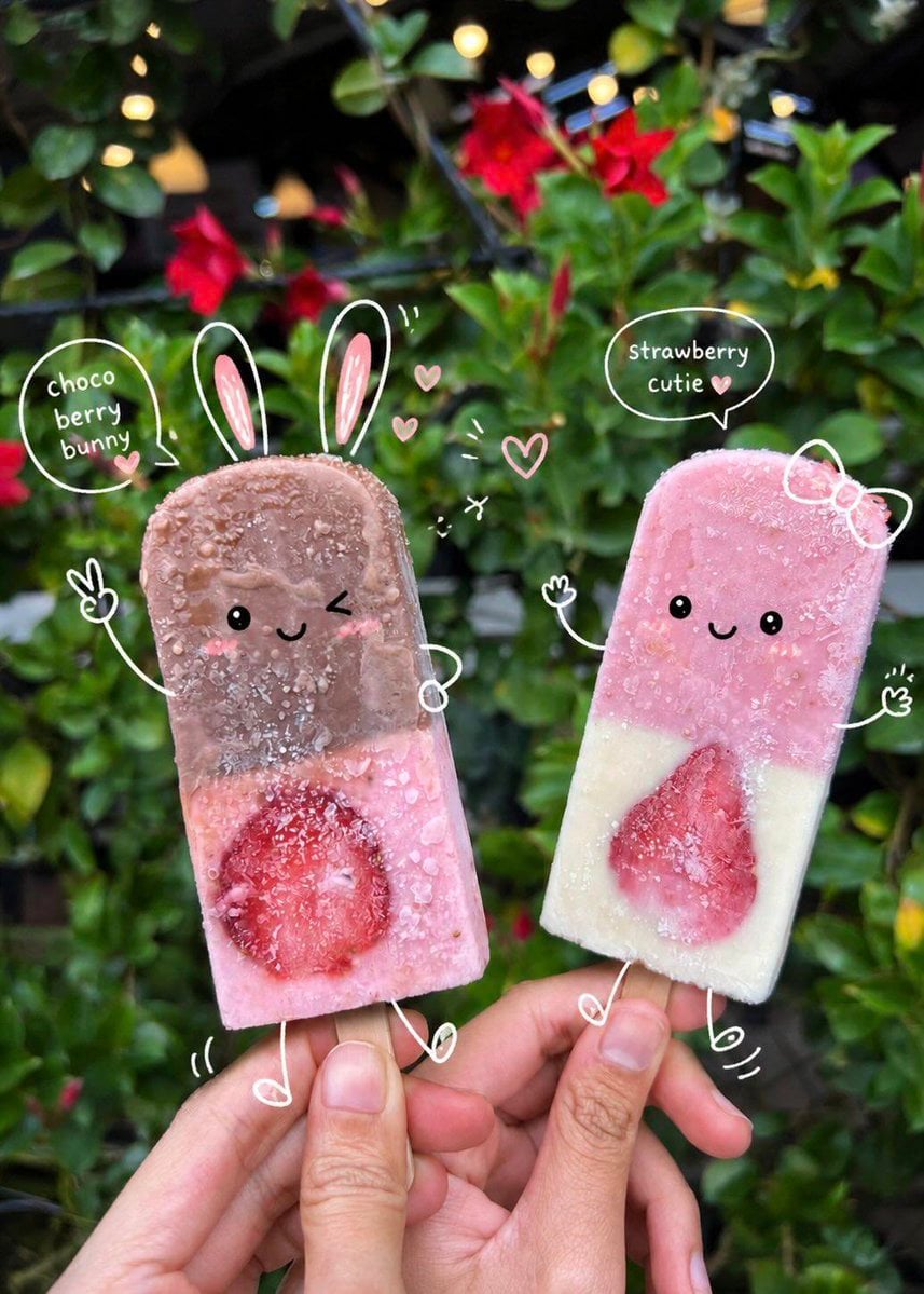 {
   Prompt: {
Cute kawaii-style food and cafe photography with playful doodle overlays and vibrant Instagram aesthetics