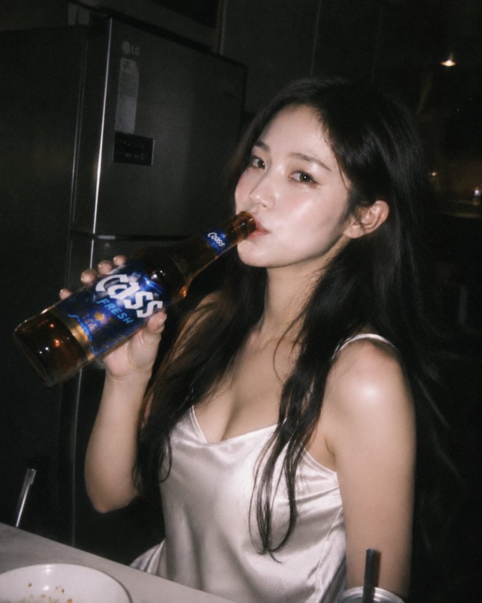 Ultra-realistic candid night photography of a beautiful [Hero Subject: East Asian] woman with long black hair wearing a 