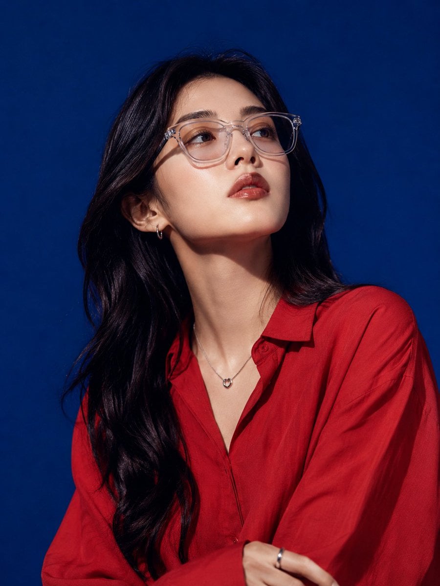 Ultra-realistic high-fashion studio portrait of a beautiful young [Hero Subject: East Asian] woman with long wavy black 