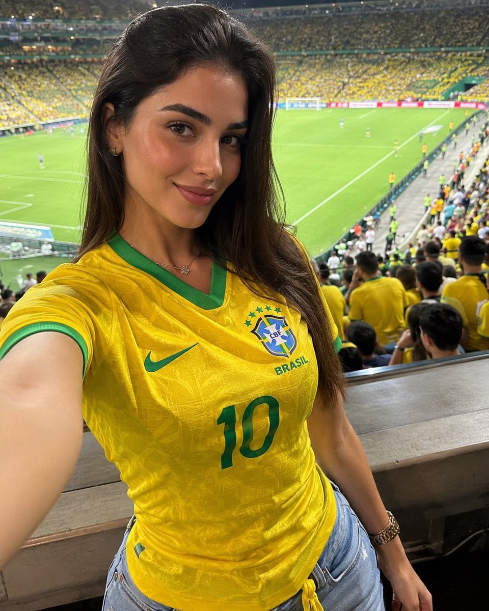 [Hero Subject: Brazil Fan Girl Stadium Selfie] ([Hero Subject: Match Day])

Ultra-realistic smartphone selfie of a beaut