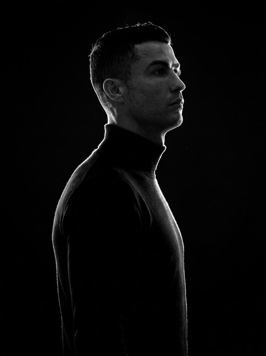 A minimalist black and white cinematic portrait featuring two individuals (male …