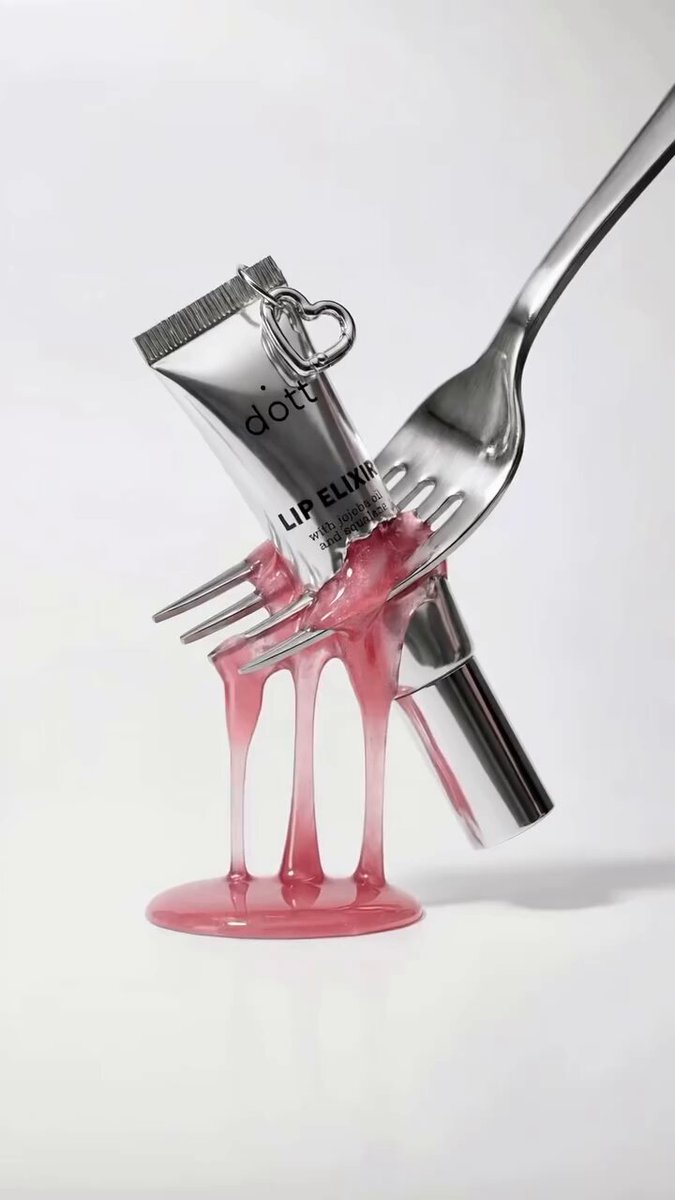 Kling AI - Sleek Silver Lip Gloss and Stainless Steel Fork؛ محتوای مرتبط هوش مصنوعی در Axeto