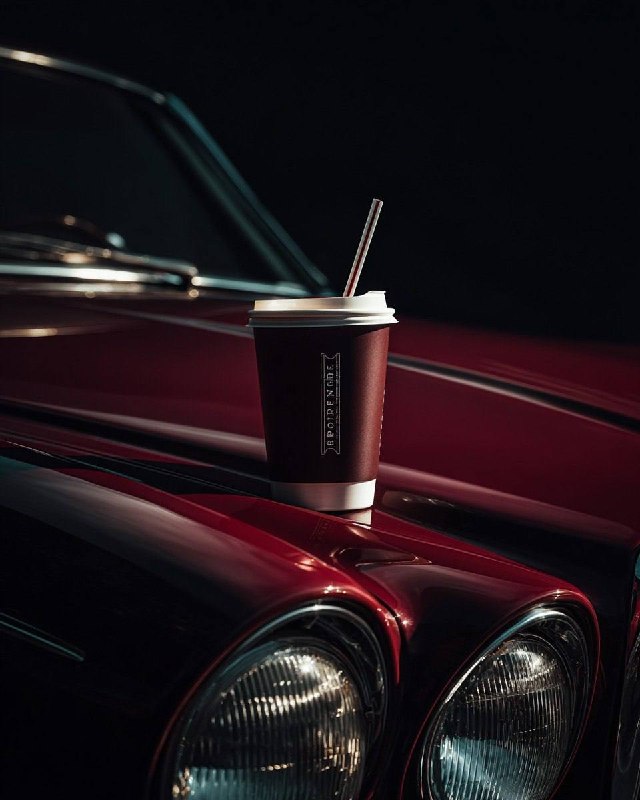 minimal cinematic product shot, a white takeaway cup with lid and straw placed o…